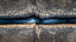 © Lucianastudio - Fractured earth meets watery flow creating a textured abstract landscape from above in parched terrain