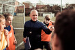 © Davor - Soccer coach giving pep talk to girls team before game
