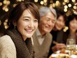 © rfassets - Warm Holiday Dinner with Smiling Asian Family and Bokeh Lights