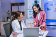 ©  NCST Studio - Two businesswomen are discussing and working together using laptop computer and digital tablet at the office