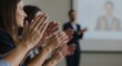 © Iuliia - An expressive gesture of applause captures gratitude and motivation. Claps achievement and support. Speaker, presenter speaks at lecture, presentation, training for group of people. Selective focus