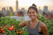 © Amal - A smiling woman in a rooftop garden, surrounded by lush tomato plants with a city skyline at sunset.