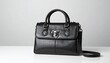 © Sonu - black leather handbag