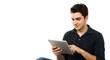 © Tadeu - Man using tablet device for online browsing and digital media consumption on white background isolated