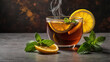 © Ilhamm - close up of a steaming hot glass of tea with fresh lemon slices and aromatic mint leaves