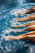 © prostooleh - Low section of legs dangling in swimming pool
