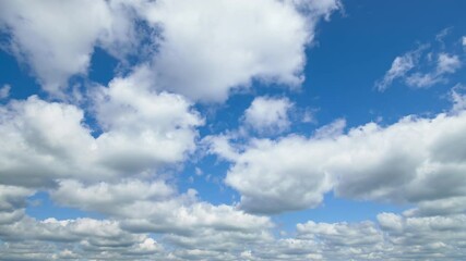 Wall Mural - beautiful blue sky with soft white clouds timelapse for abstract background