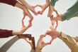 © Studio Romantic - Unknown diverse people shaping heart sign with hands, posing in circle, demonstrating community, support and love, isolated over white background. People equality and justice in society