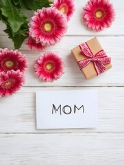  Celebrating motherhood with pink flowers and a small gift on a wooden surface during a special occasion