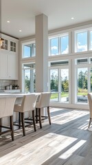 Fototapete - Sunlight streams through expansive windows in this contemporary kitchen, highlighting the sleek cabinetry and spacious dining area with bar seating