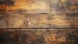 © Rstm - Photograph of wooden planks create a rustic, weathered background with visible grain and dark stains.