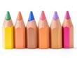 © sandi - Colorful pencils in a row.  Close-up view of sharpened colored pencils, arranged in a straight line against a white background.  Vibrant hues create a spectrum of colors