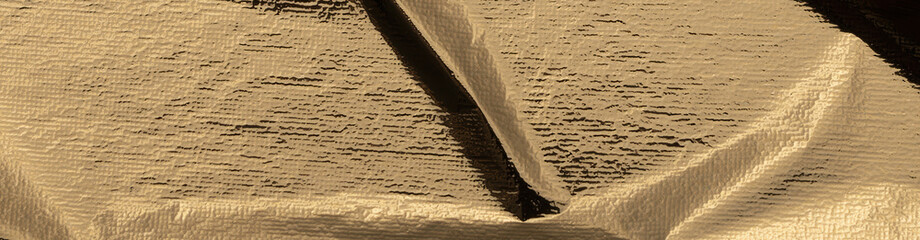 Poster - Gold foil crumpled texture with a shiny, metallic surface. Abstract, reflective pattern with folds