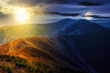 Wall Mural - mountain landscape with sun and moon at twilight. traverse path through hill side to the mountain to