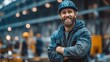 © tongpatong - This attractive, cheerful, and industrious Caucasian blue-collar worker is standing in a factory wearing a protective suit and a hardhat.