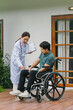 © Kritdanai - Doctor Examining Patient in Wheelchair