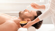 © Prostock-studio - Handsome bearded man having face treatment at male spa salon, side view, copy space. Relaxed middle aged man enjoying day at luxury spa, getting anti-aging face mask, closeup