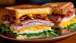 © CrazyJuke - A classic club sandwich stacked high with layers of savory meat, creamy cheese, and crisp greens on a rustic plate.