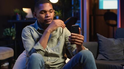 Wall Mural - african american guy attends web conference call on laptop sitting at home, joining an remote webina