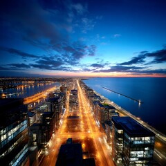 Poster - Urban Illumination: A Dazzling Cityscape at Nightfall, Where the City Meets the Lake Under a Dramatic Skyline