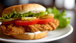 © Thisisbest - Delicious Lightly Breaded Chicken Breast Filet Sandwich with Fresh Vegetables on a Soft Bun