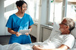 © Westend61 - Nurse providing care and support to a patient in a hospital setting