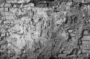 gray background, in the photo an old brick wall and cement