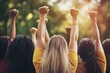 © Seema Designs - Group of Strong and Determined Women Raising Fists in Empowerment
