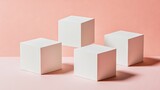 Four white cubes arranged on a pale pink surface.