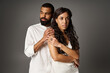 © LIGHTFIELD STUDIOS - Stylish couple showcases modern romance in a captivating indoor setting
