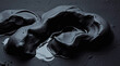 © Svitlana - Sculptural clay art, intense jet black water, pure black, deep shadows, modeled shapes, textured surface, monochromatic palette.jpg