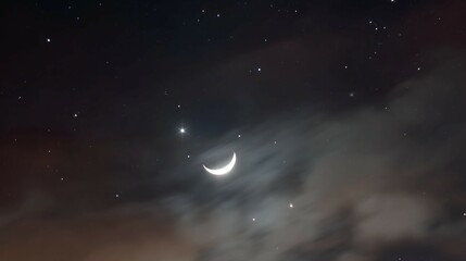 Wall Mural - Crescent moon and stars visible through clouds in a dark night sky.