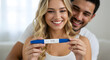 © abu - Ecstatic Couple Holding A Positive Pregnancy Test Result in Brightly Lit Interior with Fair Skinned Woman and Dark Haired Man Celebrating Future Parenthood