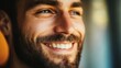 © Molly P - A close-up portrait of a happy man with a beard, showcasing his joyful expression and bright smile. The soft natural lighting enhances the warmth and charm of the moment.