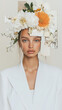 © oceanrider - Elegant editorial fashion image with woman in white jacket and flowers