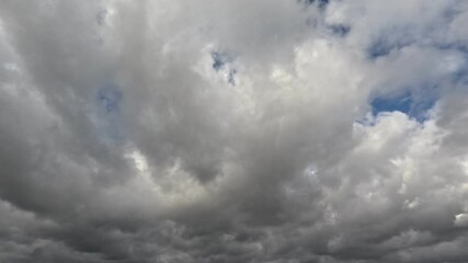 Wall Mural - Incredibly beautiful grey cumulus textured clouds under blue sky on partly cloudy day. Timelapse mode.