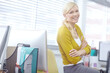 © peopleimages.com - Arms crossed, portrait and smile with web developer woman at desk in office for design or research. Administration, computer and software with happy programmer in workplace for professional coding