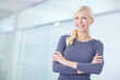 © peopleimages.com - Arms crossed, smile and thinking with business woman in hallway of office for start of career. Future, idea and vision with happy designer in creative workplace for professional administration