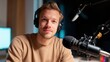 © Kharkovich - Young caucasian male podcaster in studio with microphone and headphones