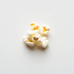 Poster - Studio shot of fluffy popcorn on a stark white backdrop, highlighting its texture and shape for a visually appealing and simple composition.