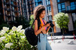 © deagreez - Photo of young girl backpack equipment hold camera photographer wear colorful outfit park sunlight spring weather travel weekend outside