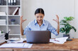 © David - Stress, anxiety or headache of business asian woman working on laptop online report, proposal or copywriting at workplace office desk Burnout, frustrated corporate worker with problem, fail or error.
