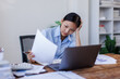 © David - Stress, anxiety or headache of business asian woman working on laptop online report, proposal or copywriting at workplace office desk Burnout, frustrated corporate worker with problem, fail or error.