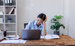 © David - Stress, anxiety or headache of business asian woman working on laptop online report, proposal or copywriting at workplace office desk Burnout, frustrated corporate worker with problem, fail or error.