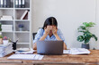 © David - Stress, anxiety or headache of business asian woman working on laptop online report, proposal or copywriting at workplace office desk Burnout, frustrated corporate worker with problem, fail or error.