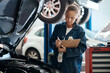 © peopleimages.com - Workshop, woman or car mechanic with clipboard for writing, maintenance and engine inspection. Repair shop, service and female expert with checklist, auto experience and vehicle notes in garage