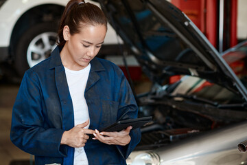 Poster - Tablet, inspection and woman in workshop with car service, maintenance or online motor insurance. Tech, engine and female mechanic in garage on digital app for checklist, repair and quality assurance
