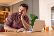 © Graphicroyalty - Businessman office working holding sore head pain from desk working and sitting all day using laptop computer or notebook suffering headache sick worker overworking concept
