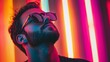 © Juan - Stylish man with sunglasses under neon lights fashion portrait colorful mood bold modern male