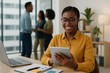 © Jony - Happy African American Businesswoman Using Tablet Modern Office Background Successful Entrepreneur Working Digital Device Technology Smart Casual Style Professional Woman Businesswoman at Work